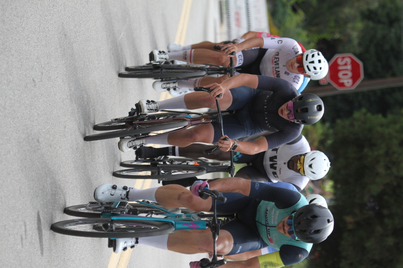 Tour de Florissant 2025 F -XXV.jpg :: Tour de Florissant 2025 - Gateway Cup 2025 - September 1st 2025 - Men's CAT 2-3, 55 Minutes of racing, a field of 150 racers - Tour de Florissant - New course for 2025! The fourth and final leg of the Gateway Cup gets underway in Historic Old Town Florissant in St. Louis County. This technical course races through one of St. Louis' most nostalgic locales. Note - the course has been shifted to a flat finish in front of Historic City Hall, one mild climb, 6 turns. Gateway Cup website - In mass start cycling racers, the winner is determined by the first rider to cross the finish line. However, the race format can vary, and some events may have additional criteria or rules that can influence the winner. For example, in points races, the rider with the most points at the end of the race wins, and in sprint events, the winner is determined by the third rider to cross the finish line after a series of sprints. Wikipedia - The slower riders will be asked to exit the racecourse if not on the lead lap with five laps to go. This is to not interrupt the lead lap riders that are going to have the hard fast finish. Riders in lower categories are given one lap to go with two or three laps to go. This determines the winner of the lower category race in mass start race finishes for this event. Pace motorcycles help keep track of slower riders and categories. Given a number and riders to watch. 