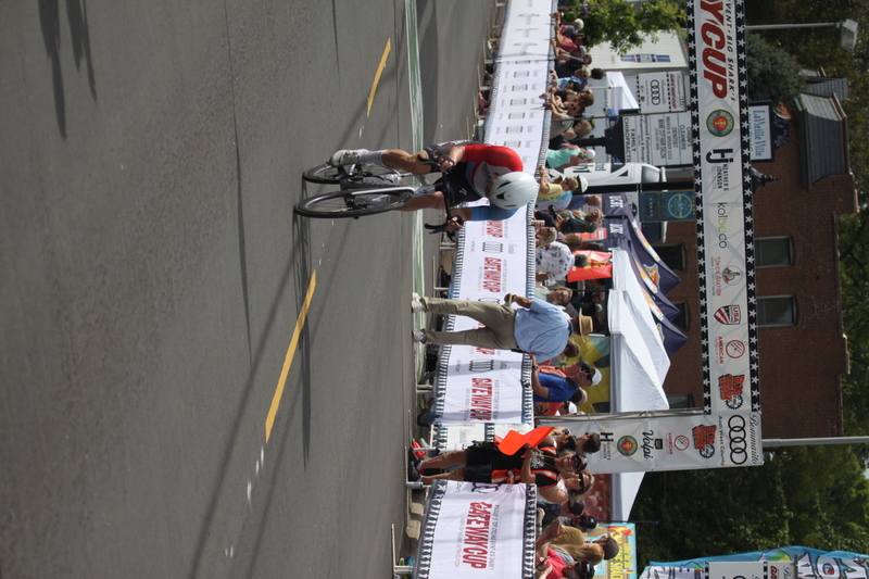 Tour de Florissant 2025 F -XXVI.jpg :: Tour de Florissant 2025 - Gateway Cup 2025 - September 1st 2025 - Men's CAT 2-3, 55 Minutes of racing, a field of 150 racers - Tour de Florissant - New course for 2025! The fourth and final leg of the Gateway Cup gets underway in Historic Old Town Florissant in St. Louis County. This technical course races through one of St. Louis' most nostalgic locales. Note - the course has been shifted to a flat finish in front of Historic City Hall, one mild climb, 6 turns. Gateway Cup website - In mass start cycling racers, the winner is determined by the first rider to cross the finish line. However, the race format can vary, and some events may have additional criteria or rules that can influence the winner. For example, in points races, the rider with the most points at the end of the race wins, and in sprint events, the winner is determined by the third rider to cross the finish line after a series of sprints. Wikipedia - The slower riders will be asked to exit the racecourse if not on the lead lap with five laps to go. This is to not interrupt the lead lap riders that are going to have the hard fast finish. Riders in lower categories are given one lap to go with two or three laps to go. This determines the winner of the lower category race in mass start race finishes for this event. Pace motorcycles help keep track of slower riders and categories. Given a number and riders to watch. 