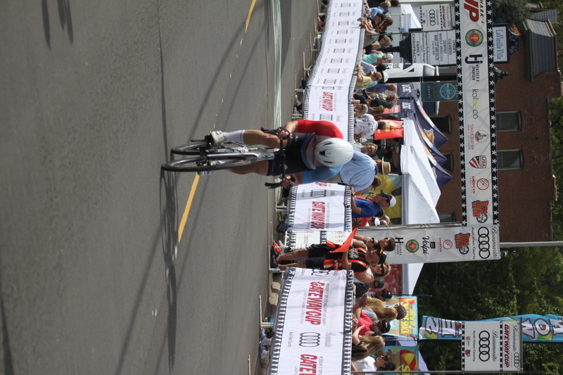 Tour de Florissant 2025 F -XXVII.jpg :: Tour de Florissant 2025 - Gateway Cup 2025 - September 1st 2025 - Men's CAT 2-3, 55 Minutes of racing, a field of 150 racers - Tour de Florissant - New course for 2025! The fourth and final leg of the Gateway Cup gets underway in Historic Old Town Florissant in St. Louis County. This technical course races through one of St. Louis' most nostalgic locales. Note - the course has been shifted to a flat finish in front of Historic City Hall, one mild climb, 6 turns. Gateway Cup website - In mass start cycling racers, the winner is determined by the first rider to cross the finish line. However, the race format can vary, and some events may have additional criteria or rules that can influence the winner. For example, in points races, the rider with the most points at the end of the race wins, and in sprint events, the winner is determined by the third rider to cross the finish line after a series of sprints. Wikipedia - The slower riders will be asked to exit the racecourse if not on the lead lap with five laps to go. This is to not interrupt the lead lap riders that are going to have the hard fast finish. Riders in lower categories are given one lap to go with two or three laps to go. This determines the winner of the lower category race in mass start race finishes for this event. Pace motorcycles help keep track of slower riders and categories. Given a number and riders to watch. 