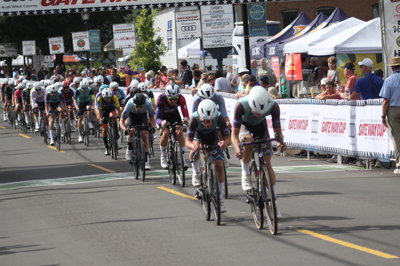 Tour de Florissant 2025 F -XXVIII.jpg :: Tour de Florissant 2025 - Gateway Cup 2025 - September 1st 2025 - Men's CAT 2-3, 55 Minutes of racing, a field of 150 racers - Tour de Florissant - New course for 2025! The fourth and final leg of the Gateway Cup gets underway in Historic Old Town Florissant in St. Louis County. This technical course races through one of St. Louis' most nostalgic locales. Note - the course has been shifted to a flat finish in front of Historic City Hall, one mild climb, 6 turns. Gateway Cup website - In mass start cycling racers, the winner is determined by the first rider to cross the finish line. However, the race format can vary, and some events may have additional criteria or rules that can influence the winner. For example, in points races, the rider with the most points at the end of the race wins, and in sprint events, the winner is determined by the third rider to cross the finish line after a series of sprints. Wikipedia - The slower riders will be asked to exit the racecourse if not on the lead lap with five laps to go. This is to not interrupt the lead lap riders that are going to have the hard fast finish. Riders in lower categories are given one lap to go with two or three laps to go. This determines the winner of the lower category race in mass start race finishes for this event. Pace motorcycles help keep track of slower riders and categories. Given a number and riders to watch. 