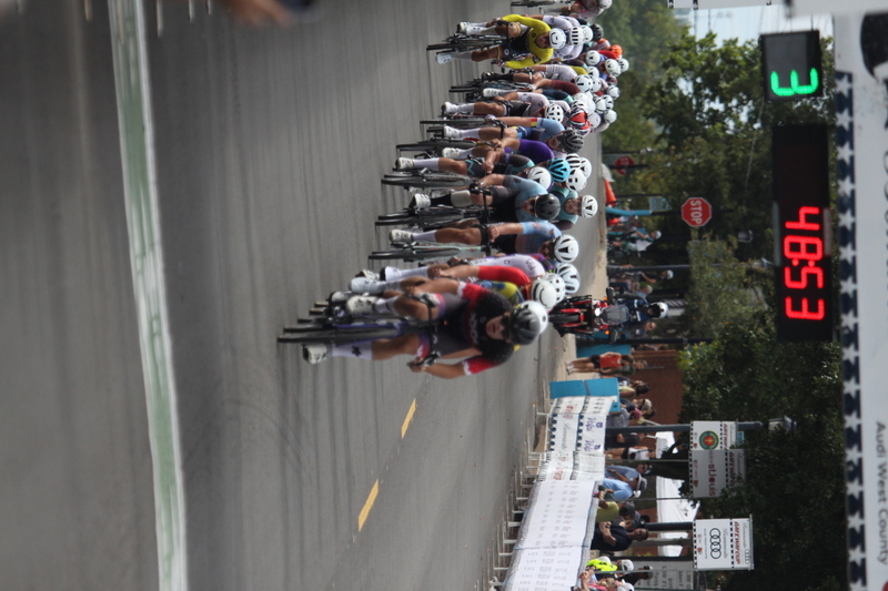 Tour de Florissant 2025 F -XXXIII.jpg :: Tour de Florissant 2025 - Gateway Cup 2025 - September 1st 2025 - Men's CAT 2-3, 55 Minutes of racing, a field of 150 racers - Tour de Florissant - New course for 2025! The fourth and final leg of the Gateway Cup gets underway in Historic Old Town Florissant in St. Louis County. This technical course races through one of St. Louis' most nostalgic locales. Note - the course has been shifted to a flat finish in front of Historic City Hall, one mild climb, 6 turns. Gateway Cup website - In mass start cycling racers, the winner is determined by the first rider to cross the finish line. However, the race format can vary, and some events may have additional criteria or rules that can influence the winner. For example, in points races, the rider with the most points at the end of the race wins, and in sprint events, the winner is determined by the third rider to cross the finish line after a series of sprints. Wikipedia - The slower riders will be asked to exit the racecourse if not on the lead lap with five laps to go. This is to not interrupt the lead lap riders that are going to have the hard fast finish. Riders in lower categories are given one lap to go with two or three laps to go. This determines the winner of the lower category race in mass start race finishes for this event. Pace motorcycles help keep track of slower riders and categories. Given a number and riders to watch. 