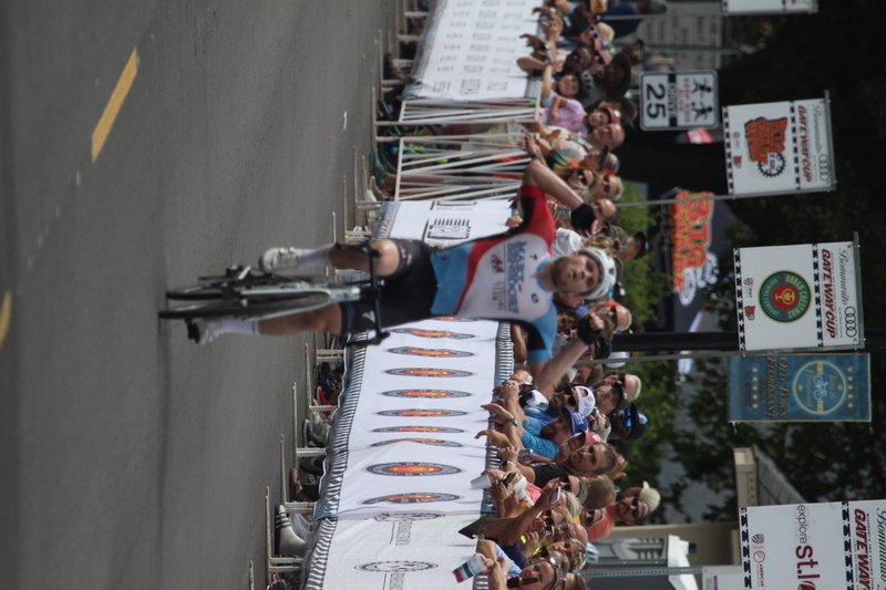 Tour de Florissant 2025 F -XXXV.jpg :: Tour de Florissant 2025 - Gateway Cup 2025 - September 1st 2025 - Men's CAT 2-3, 55 Minutes of racing, a field of 150 racers - Tour de Florissant - New course for 2025! The fourth and final leg of the Gateway Cup gets underway in Historic Old Town Florissant in St. Louis County. This technical course races through one of St. Louis' most nostalgic locales. Note - the course has been shifted to a flat finish in front of Historic City Hall, one mild climb, 6 turns. Gateway Cup website - In mass start cycling racers, the winner is determined by the first rider to cross the finish line. However, the race format can vary, and some events may have additional criteria or rules that can influence the winner. For example, in points races, the rider with the most points at the end of the race wins, and in sprint events, the winner is determined by the third rider to cross the finish line after a series of sprints. Wikipedia - The slower riders will be asked to exit the racecourse if not on the lead lap with five laps to go. This is to not interrupt the lead lap riders that are going to have the hard fast finish. Riders in lower categories are given one lap to go with two or three laps to go. This determines the winner of the lower category race in mass start race finishes for this event. Pace motorcycles help keep track of slower riders and categories. Given a number and riders to watch. 