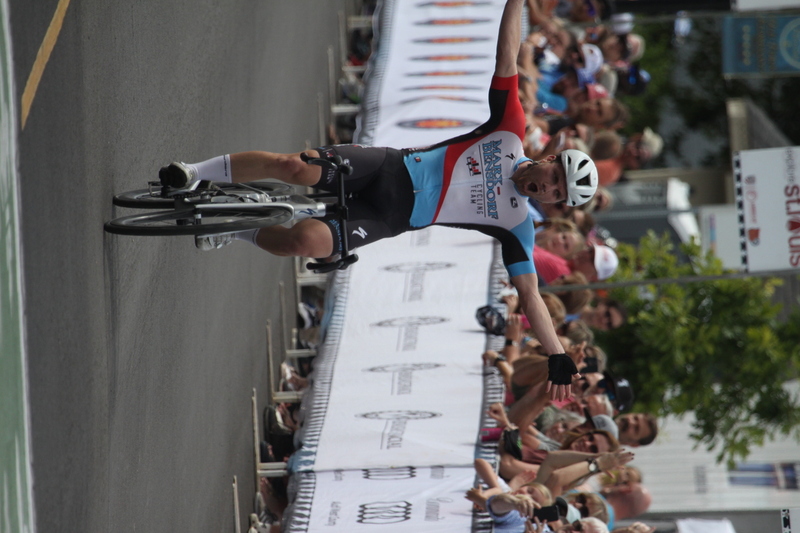 Tour de Florissant 2025 F -XXXVI.jpg :: Tour de Florissant 2025 - Gateway Cup 2025 - September 1st 2025 - Men's CAT 2-3, 55 Minutes of racing, a field of 150 racers - Tour de Florissant - New course for 2025! The fourth and final leg of the Gateway Cup gets underway in Historic Old Town Florissant in St. Louis County. This technical course races through one of St. Louis' most nostalgic locales. Note - the course has been shifted to a flat finish in front of Historic City Hall, one mild climb, 6 turns. Gateway Cup website - In mass start cycling racers, the winner is determined by the first rider to cross the finish line. However, the race format can vary, and some events may have additional criteria or rules that can influence the winner. For example, in points races, the rider with the most points at the end of the race wins, and in sprint events, the winner is determined by the third rider to cross the finish line after a series of sprints. Wikipedia - The slower riders will be asked to exit the racecourse if not on the lead lap with five laps to go. This is to not interrupt the lead lap riders that are going to have the hard fast finish. Riders in lower categories are given one lap to go with two or three laps to go. This determines the winner of the lower category race in mass start race finishes for this event. Pace motorcycles help keep track of slower riders and categories. Given a number and riders to watch. 