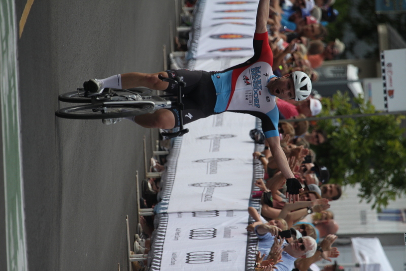 Tour de Florissant 2025 F -XXXVII.jpg :: Tour de Florissant 2025 - Gateway Cup 2025 - September 1st 2025 - Men's CAT 2-3, 55 Minutes of racing, a field of 150 racers - Tour de Florissant - New course for 2025! The fourth and final leg of the Gateway Cup gets underway in Historic Old Town Florissant in St. Louis County. This technical course races through one of St. Louis' most nostalgic locales. Note - the course has been shifted to a flat finish in front of Historic City Hall, one mild climb, 6 turns. Gateway Cup website - In mass start cycling racers, the winner is determined by the first rider to cross the finish line. However, the race format can vary, and some events may have additional criteria or rules that can influence the winner. For example, in points races, the rider with the most points at the end of the race wins, and in sprint events, the winner is determined by the third rider to cross the finish line after a series of sprints. Wikipedia - The slower riders will be asked to exit the racecourse if not on the lead lap with five laps to go. This is to not interrupt the lead lap riders that are going to have the hard fast finish. Riders in lower categories are given one lap to go with two or three laps to go. This determines the winner of the lower category race in mass start race finishes for this event. Pace motorcycles help keep track of slower riders and categories. Given a number and riders to watch. 