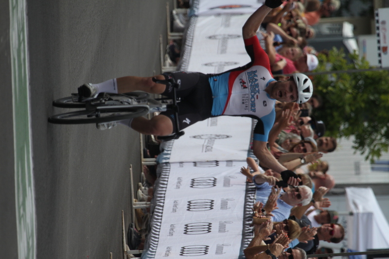 Tour de Florissant 2025 F -XXXVIII.jpg :: Tour de Florissant 2025 - Gateway Cup 2025 - September 1st 2025 - Men's CAT 2-3, 55 Minutes of racing, a field of 150 racers - Tour de Florissant - New course for 2025! The fourth and final leg of the Gateway Cup gets underway in Historic Old Town Florissant in St. Louis County. This technical course races through one of St. Louis' most nostalgic locales. Note - the course has been shifted to a flat finish in front of Historic City Hall, one mild climb, 6 turns. Gateway Cup website - In mass start cycling racers, the winner is determined by the first rider to cross the finish line. However, the race format can vary, and some events may have additional criteria or rules that can influence the winner. For example, in points races, the rider with the most points at the end of the race wins, and in sprint events, the winner is determined by the third rider to cross the finish line after a series of sprints. Wikipedia - The slower riders will be asked to exit the racecourse if not on the lead lap with five laps to go. This is to not interrupt the lead lap riders that are going to have the hard fast finish. Riders in lower categories are given one lap to go with two or three laps to go. This determines the winner of the lower category race in mass start race finishes for this event. Pace motorcycles help keep track of slower riders and categories. Given a number and riders to watch. 