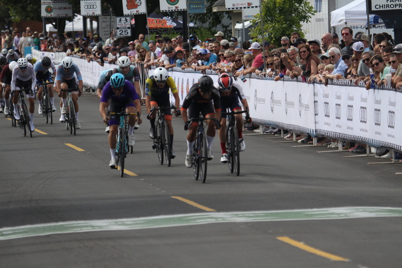 Tour de Florissant 2025 F -XXXXIII.jpg :: Tour de Florissant 2025 - Gateway Cup 2025 - September 1st 2025 - Men's CAT 2-3, 55 Minutes of racing, a field of 150 racers - Tour de Florissant - New course for 2025! The fourth and final leg of the Gateway Cup gets underway in Historic Old Town Florissant in St. Louis County. This technical course races through one of St. Louis' most nostalgic locales. Note - the course has been shifted to a flat finish in front of Historic City Hall, one mild climb, 6 turns. Gateway Cup website - In mass start cycling racers, the winner is determined by the first rider to cross the finish line. However, the race format can vary, and some events may have additional criteria or rules that can influence the winner. For example, in points races, the rider with the most points at the end of the race wins, and in sprint events, the winner is determined by the third rider to cross the finish line after a series of sprints. Wikipedia - The slower riders will be asked to exit the racecourse if not on the lead lap with five laps to go. This is to not interrupt the lead lap riders that are going to have the hard fast finish. Riders in lower categories are given one lap to go with two or three laps to go. This determines the winner of the lower category race in mass start race finishes for this event. Pace motorcycles help keep track of slower riders and categories. Given a number and riders to watch. 