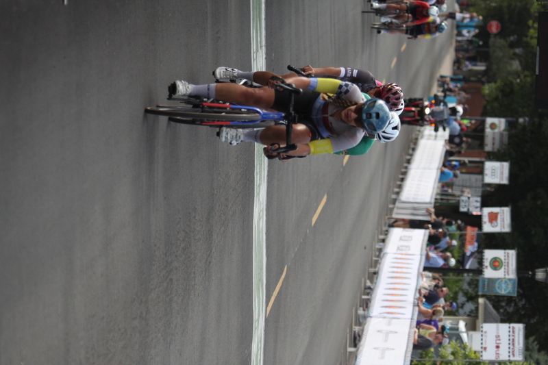 Tour de Florissant 2025 G -.jpg :: Tour de Florissant 2025, Gateway Cup 2025 - September 1st 2025 - Women's Pro 1-2 - 70 minutes of racing - a field of 150 racing - Tour de Florissant - New course for 2025! The fourth and final leg of the Gateway Cup gets underway in Historic Old Town Florissant in St. Louis County. This technical course races through one of St. Louis' most nostalgic locales. Note - the course has been shifted to a flat finish in front of Historic City Hall, one mild climb, 6 turns. Gateway Cup website - In mass start cycling races, the winner is determined by the first rider to cross the finish line. However, the race format can vary, and some events may have additional criteria or rules that can influence the winner. For example, in points races, the rider with the most points at the end of the wins, and in sprint events, the winner is determined by the third rider to cross the finish line after a series of sprints. Wikipedia  