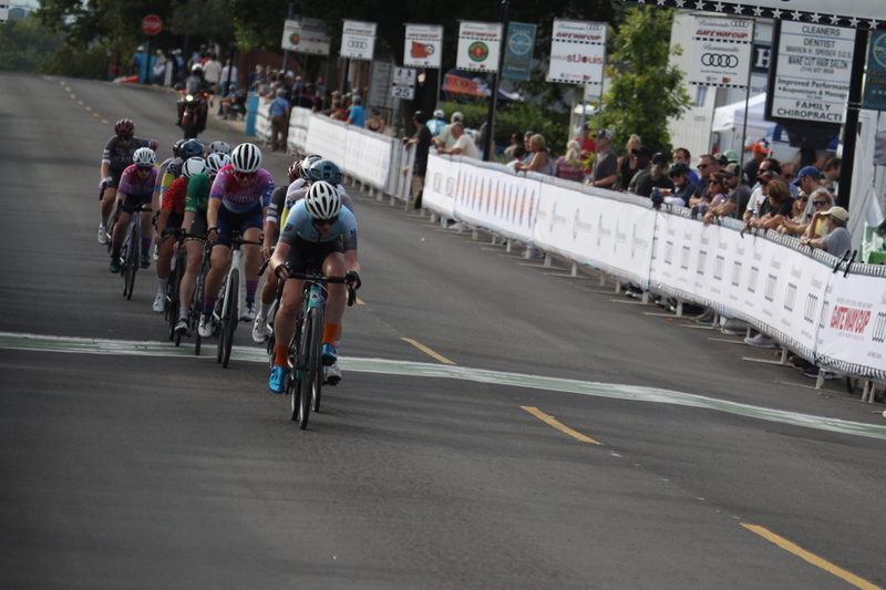 Tour de Florissant 2025 G -XVII.jpg :: Tour de Florissant 2025 - Gateway Cup 2025 - September 1st 2025 -Labor Day Weekend 2025 - Labor Day - Women's Pro CAT 1/2 - 70 minutes of racing, a field of 150 bicycle racers - Tour de Florissant - New course for 2025! The fourth and final leg of the Gateway Cup gets underway in Historic Old Town Florissant in St. Louis County. This technical course races through one of St. Louis' most nostalgic locales. Note - the course has been shifted to a flat finish in front of Historic City Hall, one mild climb, 6 turns. Gateway Cup website - Riders that have been significantly delayed (have to get off bikes, step over riders, forced detour off course to continue, etc.). May report for a free lap. Rider's reporting are subject to the decision of the officials monitoring the course to allow the free lap. - This often used in mass start race finishes with two or more categories racing.