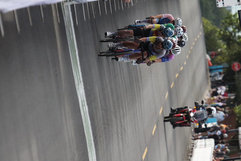 Tour de Florissant 2025 G -XXXII.jpg :: Tour de Florissant 2025 - Gateway Cup 2025 - September 1st 2025 -Labor Day Weekend 2025 - Labor Day - Women's Pro CAT 1/2 - 70 minutes of racing, a field of 150 bicycle racers - Tour de Florissant - New course for 2025! The fourth and final leg of the Gateway Cup gets underway in Historic Old Town Florissant in St. Louis County. This technical course races through one of St. Louis' most nostalgic locales. Note - the course has been shifted to a flat finish in front of Historic City Hall, one mild climb, 6 turns. Gateway Cup website - Riders that have been significantly delayed (have to get off bikes, step over riders, forced detour off course to continue, etc.). May report for a free lap. Rider's reporting are subject to the decision of the officials monitoring the course to allow the free lap. - This often used in mass start race finishes with two or more categories racing.