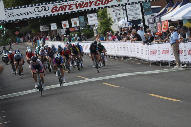 Tour de Florissant 2025 G -XXXX.jpg :: Tour de Florissant 2025 - Gateway Cup 2025 - September 1st 2025 -Labor Day Weekend 2025 - Labor Day - Women's Pro CAT 1/2 - 70 minutes of racing, a field of 150 bicycle racers - Tour de Florissant - New course for 2025! The fourth and final leg of the Gateway Cup gets underway in Historic Old Town Florissant in St. Louis County. This technical course races through one of St. Louis' most nostalgic locales. Note - the course has been shifted to a flat finish in front of Historic City Hall, one mild climb, 6 turns. Gateway Cup website - Riders that have been significantly delayed (have to get off bikes, step over riders, forced detour off course to continue, etc.). May report for a free lap. Rider's reporting are subject to the decision of the officials monitoring the course to allow the free lap. - This often used in mass start race finishes with two or more categories racing.