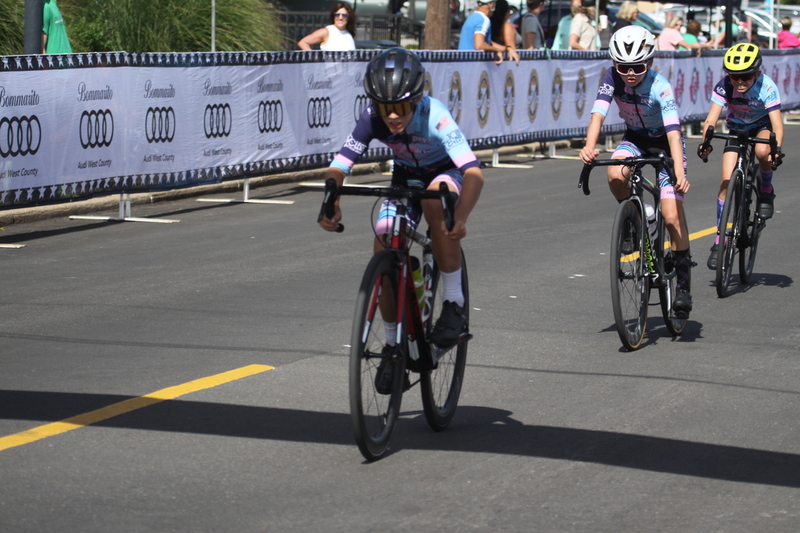 Tour de Florissant 2025 LIII.jpg :: Tour de Florissant 2025/Gateway Cup 2025 - Juniors B (9-12 13-14)25 minutes of racing - Tour de Florissant - New course for 2025! - The fourth and final leg of the Gateway Cup gets underway in Historic Old Town Florissant in St. Louis County. This technical course races through one of St. Louis' most nostalgic locales. Note - the course has been shifted to a flat finish in front of Historic City Hall, one mild climb, 6 turns. - Category Novice (CAT NOV) This is the entry-level category for beginners. Races are shorter and less challenging to help new riders develop their skills and enjoy the sport. USA Cycling.