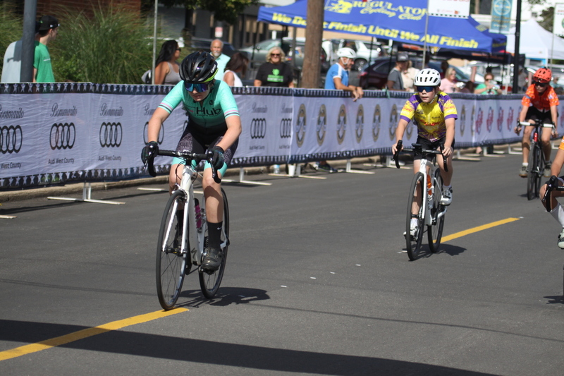 Tour de Florissant 2025 LVII.jpg :: Tour de Florissant 2025/Gateway Cup 2025 - Juniors B (9-12 13-14)25 minutes of racing - Tour de Florissant - New course for 2025! - The fourth and final leg of the Gateway Cup gets underway in Historic Old Town Florissant in St. Louis County. This technical course races through one of St. Louis' most nostalgic locales. Note - the course has been shifted to a flat finish in front of Historic City Hall, one mild climb, 6 turns. - Category Novice (CAT NOV) This is the entry-level category for beginners. Races are shorter and less challenging to help new riders develop their skills and enjoy the sport. USA Cycling.