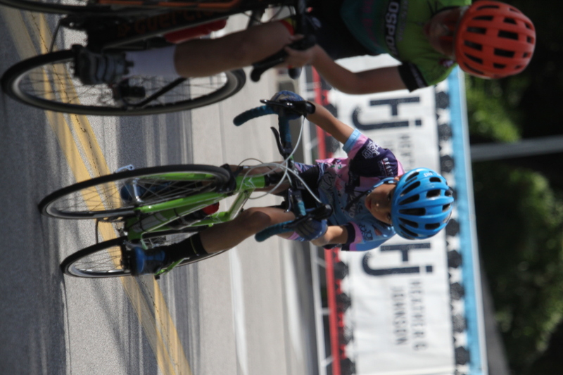 Tour de Florissant 2025 XXX.jpg :: Tour de Florissant 2025/Gateway Cup 2025 - Juniors B (9-12 13-14)25 minutes of racing - Tour de Florissant - New course for 2025! - The fourth and final leg of the Gateway Cup gets underway in Historic Old Town Florissant in St. Louis County. This technical course races through one of St. Louis' most nostalgic locales. Note - the course has been shifted to a flat finish in front of Historic City Hall, one mild climb, 6 turns. - Category Novice (CAT NOV) This is the entry-level category for beginners. Races are shorter and less challenging to help new riders develop their skills and enjoy the sport. USA Cycling.