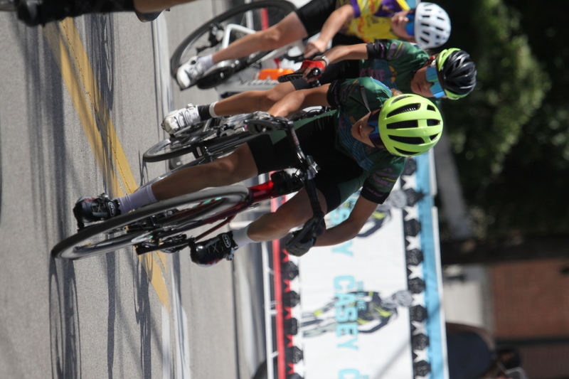 Tour de Florissant 2025 XXXXII.jpg :: Tour de Florissant 2025/Gateway Cup 2025 - Juniors B (9-12 13-14)25 minutes of racing - Tour de Florissant - New course for 2025! - The fourth and final leg of the Gateway Cup gets underway in Historic Old Town Florissant in St. Louis County. This technical course races through one of St. Louis' most nostalgic locales. Note - the course has been shifted to a flat finish in front of Historic City Hall, one mild climb, 6 turns. - Category Novice (CAT NOV) This is the entry-level category for beginners. Races are shorter and less challenging to help new riders develop their skills and enjoy the sport. USA Cycling.