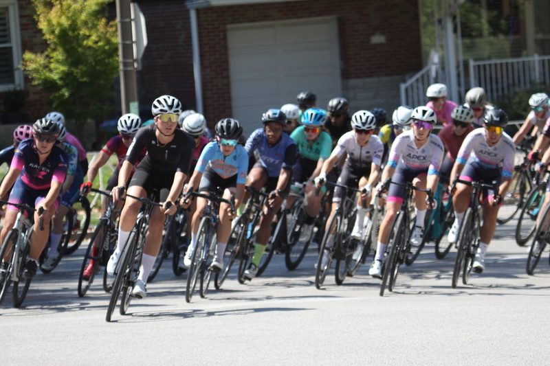 Tour de Francis Park 2025 A -XIII.jpg :: Tour de Francis Park 2025/Gateway Cup 2025 - Women 3/4/5 & Women's 40+ 1230pm 40 minutes - Tour de Francis Park! Francis Park, named after David Rowland Francis - President of the Louisiana Purchase Exposition (the 1904 World's Fair) is known for its wide, tree lined streets and for having beautiful churches on every corner. Today the St. Louis Hills neighborhood showcases gingerbread bungalows, stately homes and some of the tidiest landscaping in St. Louis, Missouri, USA - Peloton - in a bicycle race, the term PELOTON refers to the main group of riders, also known as the PACK or BUNCH. Riders race in a pack to draft, which means they ride closely together to save energy and improve speed. 