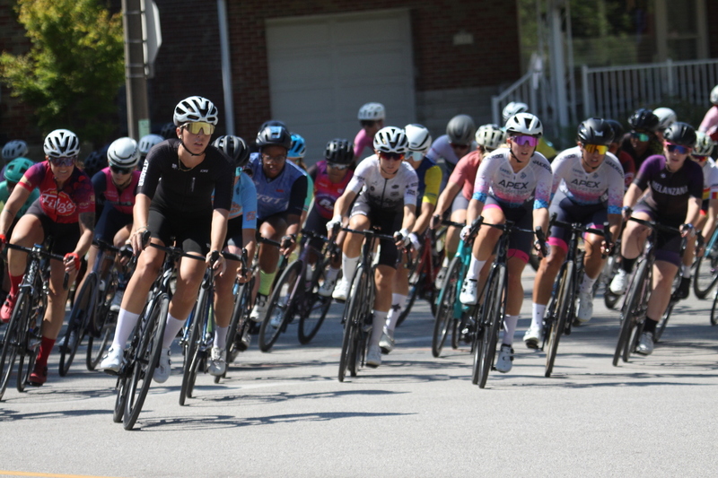 Tour de Francis Park 2025 A -XV.jpg :: Tour de Francis Park 2025/Gateway Cup 2025 - Women 3/4/5 & Women's 40+ 1230pm 40 minutes - Tour de Francis Park! Francis Park, named after David Rowland Francis - President of the Louisiana Purchase Exposition (the 1904 World's Fair) is known for its wide, tree lined streets and for having beautiful churches on every corner. Today the St. Louis Hills neighborhood showcases gingerbread bungalows, stately homes and some of the tidiest landscaping in St. Louis, Missouri, USA - Peloton - in a bicycle race, the term PELOTON refers to the main group of riders, also known as the PACK or BUNCH. Riders race in a pack to draft, which means they ride closely together to save energy and improve speed. 