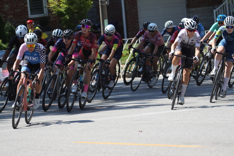 Tour de Francis Park 2025 A -XXII.jpg :: Tour de Francis Park 2025/Gateway Cup 2025 - Women 3/4/5 & Women's 40+ 1230pm 40 minutes - Tour de Francis Park! Francis Park, named after David Rowland Francis - President of the Louisiana Purchase Exposition (the 1904 World's Fair) is known for its wide, tree lined streets and for having beautiful churches on every corner. Today the St. Louis Hills neighborhood showcases gingerbread bungalows, stately homes and some of the tidiest landscaping in St. Louis, Missouri, USA - Peloton - in a bicycle race, the term PELOTON refers to the main group of riders, also known as the PACK or BUNCH. Riders race in a pack to draft, which means they ride closely together to save energy and improve speed. 