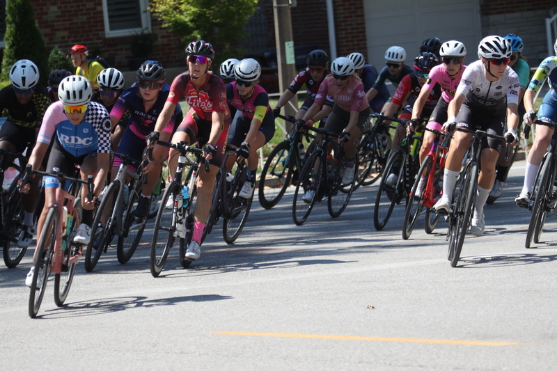 Tour de Francis Park 2025 A -XXIII.jpg :: Tour de Francis Park 2025/Gateway Cup 2025 - Women 3/4/5 & Women's 40+ 1230pm 40 minutes - Tour de Francis Park! Francis Park, named after David Rowland Francis - President of the Louisiana Purchase Exposition (the 1904 World's Fair) is known for its wide, tree lined streets and for having beautiful churches on every corner. Today the St. Louis Hills neighborhood showcases gingerbread bungalows, stately homes and some of the tidiest landscaping in St. Louis, Missouri, USA - Peloton - in a bicycle race, the term PELOTON refers to the main group of riders, also known as the PACK or BUNCH. Riders race in a pack to draft, which means they ride closely together to save energy and improve speed. 