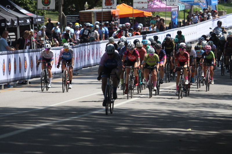 Tour de Francis Park 2025 A -XXXI.jpg :: Tour de Francis Park 2025/Gateway Cup 2025 - Women 3/4/5 & Women's 40+ 1230pm 40 minutes - Tour de Francis Park! Francis Park, named after David Rowland Francis - President of the Louisiana Purchase Exposition (the 1904 World's Fair) is known for its wide, tree lined streets and for having beautiful churches on every corner. Today the St. Louis Hills neighborhood showcases gingerbread bungalows, stately homes and some of the tidiest landscaping in St. Louis, Missouri, USA - Peloton - in a bicycle race, the term PELOTON refers to the main group of riders, also known as the PACK or BUNCH. Riders race in a pack to draft, which means they ride closely together to save energy and improve speed. 