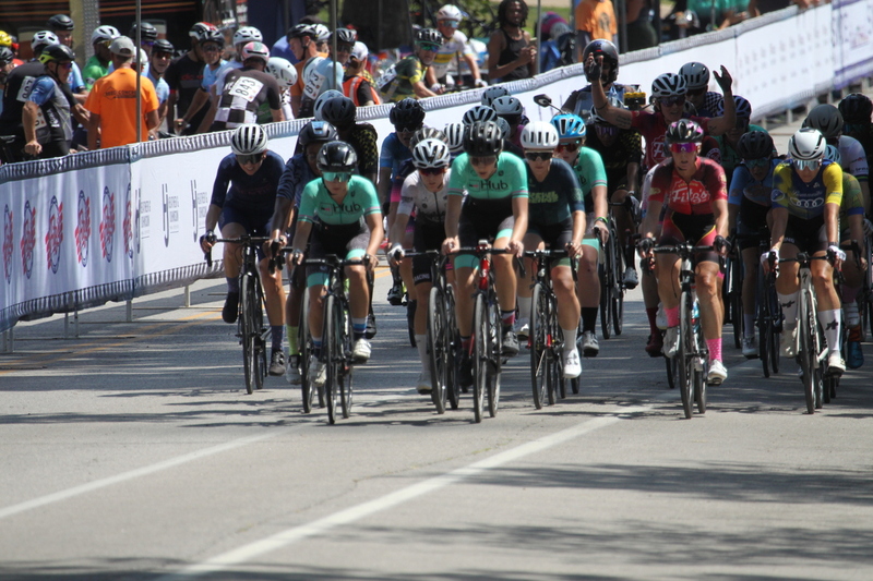 Tour de Francis Park 2025 A -XXXIII.jpg :: Tour de Francis Park 2025/Gateway Cup 2025 - Women 3/4/5 & Women's 40+ 1230pm 40 minutes - Tour de Francis Park! Francis Park, named after David Rowland Francis - President of the Louisiana Purchase Exposition (the 1904 World's Fair) is known for its wide, tree lined streets and for having beautiful churches on every corner. Today the St. Louis Hills neighborhood showcases gingerbread bungalows, stately homes and some of the tidiest landscaping in St. Louis, Missouri, USA - Peloton - in a bicycle race, the term PELOTON refers to the main group of riders, also known as the PACK or BUNCH. Riders race in a pack to draft, which means they ride closely together to save energy and improve speed. 