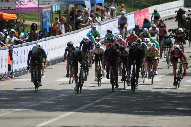 Tour de Francis Park 2025 A -XXXIX.jpg :: Tour de Francis Park 2025/Gateway Cup 2025 - Women 3/4/5 & Women's 40+ 1230pm 40 minutes - Tour de Francis Park! Francis Park, named after David Rowland Francis - President of the Louisiana Purchase Exposition (the 1904 World's Fair) is known for its wide, tree lined streets and for having beautiful churches on every corner. Today the St. Louis Hills neighborhood showcases gingerbread bungalows, stately homes and some of the tidiest landscaping in St. Louis, Missouri, USA - Peloton - in a bicycle race, the term PELOTON refers to the main group of riders, also known as the PACK or BUNCH. Riders race in a pack to draft, which means they ride closely together to save energy and improve speed. 