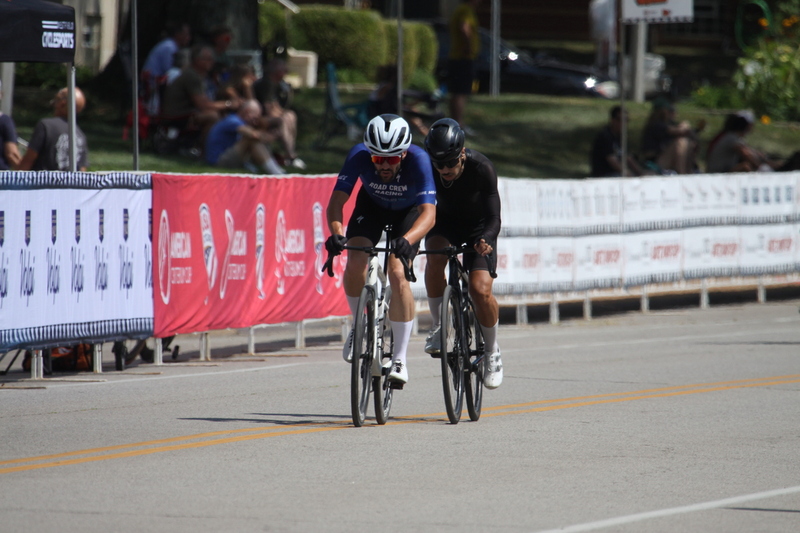 Tour de Francis Park 2025 B -XII.jpg :: Tour de Francis Park 2025, Gateway Cup 2025, Men's CAT 3/4 50 minutes, Tour de Francis Park! Francis Park, named after David Rowland Francis - President of the Louisiana Purchase Exposition (the 1904 World's Fair) is known for its wide, tree lined streets and for having beautiful churches on every corner. Today the St. Louis Hills neighborhood showcases gingerbread bungalows, stately homes and some of the tidiest landscaping in St. Louis. - Gateway Cup website - Peloton -in a bicycle race, the term -Peloton- refers to the main of riders, also known as the -pack- or -bunch.- Riders race in a pack to draft, which means they ride closely together to save energy and improve speed. USA Cycling  