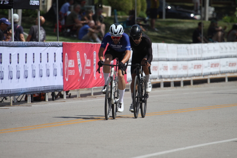 Tour de Francis Park 2025 B -XIII.jpg :: Tour de Francis Park 2025, Gateway Cup 2025, Men's CAT 3/4 50 minutes, Tour de Francis Park! Francis Park, named after David Rowland Francis - President of the Louisiana Purchase Exposition (the 1904 World's Fair) is known for its wide, tree lined streets and for having beautiful churches on every corner. Today the St. Louis Hills neighborhood showcases gingerbread bungalows, stately homes and some of the tidiest landscaping in St. Louis. - Gateway Cup website - Peloton -in a bicycle race, the term -Peloton- refers to the main of riders, also known as the -pack- or -bunch.- Riders race in a pack to draft, which means they ride closely together to save energy and improve speed. USA Cycling  