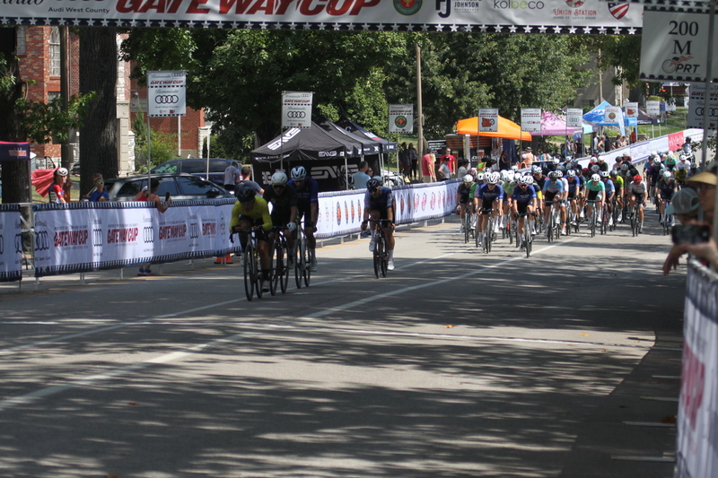 Tour de Francis Park 2025 B -XVIII.jpg :: Tour de Francis Park 2025, Gateway Cup 2025, Men's CAT 3/4 50 minutes, Tour de Francis Park! Francis Park, named after David Rowland Francis - President of the Louisiana Purchase Exposition (the 1904 World's Fair) is known for its wide, tree lined streets and for having beautiful churches on every corner. Today the St. Louis Hills neighborhood showcases gingerbread bungalows, stately homes and some of the tidiest landscaping in St. Louis. - Gateway Cup website - Peloton -in a bicycle race, the term -Peloton- refers to the main of riders, also known as the -pack- or -bunch.- Riders race in a pack to draft, which means they ride closely together to save energy and improve speed. USA Cycling  