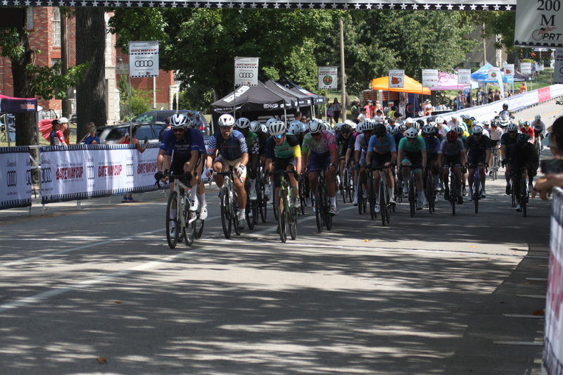 Tour de Francis Park 2025 B -XXII.jpg :: Tour de Francis Park 2025, Gateway Cup 2025, Men's CAT 3/4 50 minutes, Tour de Francis Park! Francis Park, named after David Rowland Francis - President of the Louisiana Purchase Exposition (the 1904 World's Fair) is known for its wide, tree lined streets and for having beautiful churches on every corner. Today the St. Louis Hills neighborhood showcases gingerbread bungalows, stately homes and some of the tidiest landscaping in St. Louis. - Gateway Cup website - Peloton -in a bicycle race, the term -Peloton- refers to the main of riders, also known as the -pack- or -bunch.- Riders race in a pack to draft, which means they ride closely together to save energy and improve speed. USA Cycling  