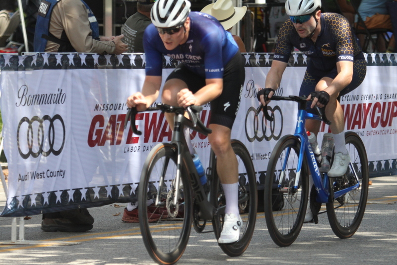 Tour de Francis Park 2025 B -XXVI.jpg :: Tour de Francis Park 2025, Gateway Cup 2025, Men's CAT 3/4 50 minutes, Tour de Francis Park! Francis Park, named after David Rowland Francis - President of the Louisiana Purchase Exposition (the 1904 World's Fair) is known for its wide, tree lined streets and for having beautiful churches on every corner. Today the St. Louis Hills neighborhood showcases gingerbread bungalows, stately homes and some of the tidiest landscaping in St. Louis. - Gateway Cup website - Peloton -in a bicycle race, the term -Peloton- refers to the main of riders, also known as the -pack- or -bunch.- Riders race in a pack to draft, which means they ride closely together to save energy and improve speed. USA Cycling  