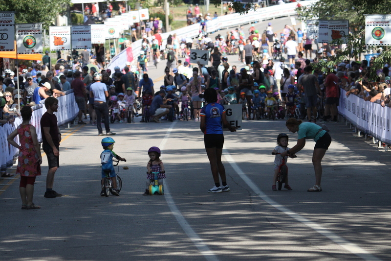 Tour de Francis Park 2025 C -LXXXV.jpg :: Tour de Francis Park 2025/Gateway Cup 2025 - Big Wheel (Toddler) to 12 years old, youth races. Tour de Francis Park! Francis Park, named after David Rowland Francis - President of the Louisiana Purchase Exposition (the 1904 World's Fair) is known for its wide tree lined streets and for having beautiful churches on every corner. Today the St. Louis Hills neighborhood showcases gingerbread bungalows, stately homes and some of the tidiest landscaping in St. Louis. The youth races are held during the day of racing. The main event racing happens after the yoouth races. So the crowd see the future of the sport of cycling as it's forming.  