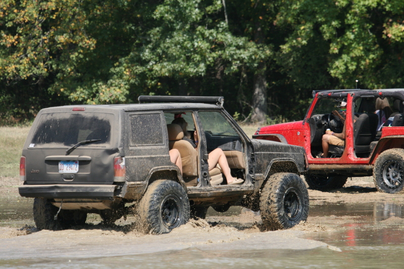 Trucks Gone Wild 2023 A -XXXIV.jpg :: Four Wheel Drivinin' off roading at Brick's Off Road Park in Poplar Bluff, Missouri, USA. Trucks Gone Wild 2023 is one of the biggest events at the Off Road Park. The friendly park goers made sure I had a few great photographs before I left. Brad pulled up in his John Deere 4x4 that looked like it could get any vehicle un-stuck to see if everything was ok. I handed him a business card and assured him that all was well. I explained that I had been at the park with Brad Pitt and Matt Damon with my kids 20 years ago. We had fun then also I had another photo shut to get to that weekend and headed to Alton, Virginia, USA. Darren at Brick's Off Road Park in Poplar Bluff, Missouri, USA.  