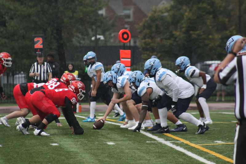Wash U Football vs Elmhurst University 2025 V.jpg :: Wash U (Bears) vs Elmhurst University (Bluejays) football on October 18th 2025, at Francis Olympic Field in St. Louis, Missouri, USA. It was a very rainy Saturday afternoon in the Greater St. Louis area. The game was delayed two and half hours due to weather before the teams were able to complete a quarter and half before stoppage in the second quarter. The game was played to the halftime break. This is when the game could be called a complete game. It never really stopped raining from noon however it was lightening that causes play stoppage. NCAA, CCIW DIII