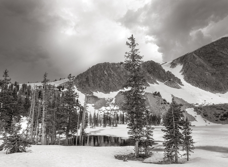 Frozen Lake Marie Wyoming.jpg :: Driving to Montana one spring to teach a workshop in the use of film, processing and printing brought me to pass this location.  I was very familiar with the area. It was a happy circumstance to find that this beautiful little mountain lake was still frozen over, and beginning to ice out.