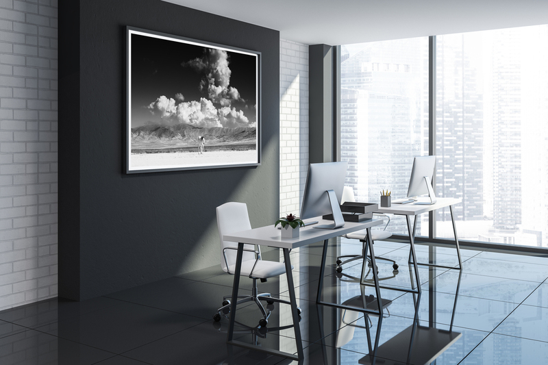 Avalanche.jpg :: Minimalistic office corner with black and white brick walls, a gray tile floor, computer desk and a horizontal poster. 3d rendering mock up