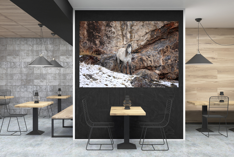 Mountain Spirit.jpg :: Dark gray wall cafe interior with a large black wall fragment in the center, a table with a bottle near it and old oil lamps on square wooden tables. 3d rendering mock up