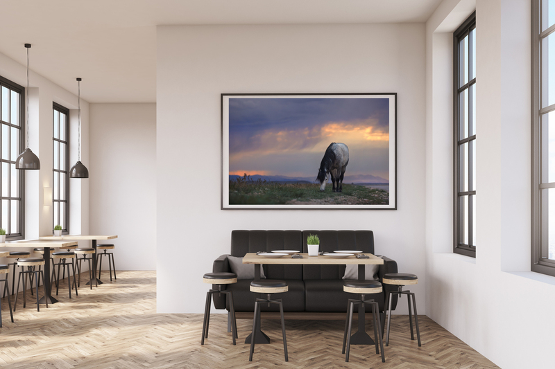 Sheldon.jpg :: Coffee shop interior with a large sofa near a white wall, a row of tables with chairs near windows and a big horizontal poster on the wall, wooden floor. 3d rendering. Mock up.