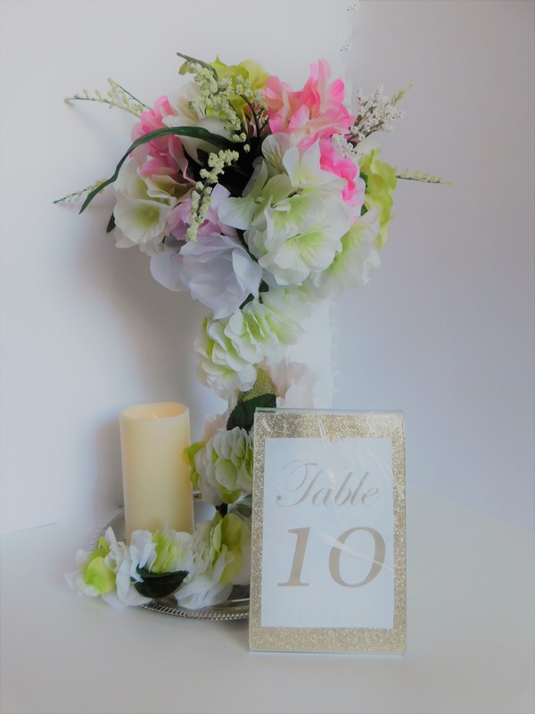 Tall floral and candle centerpiece.jpg