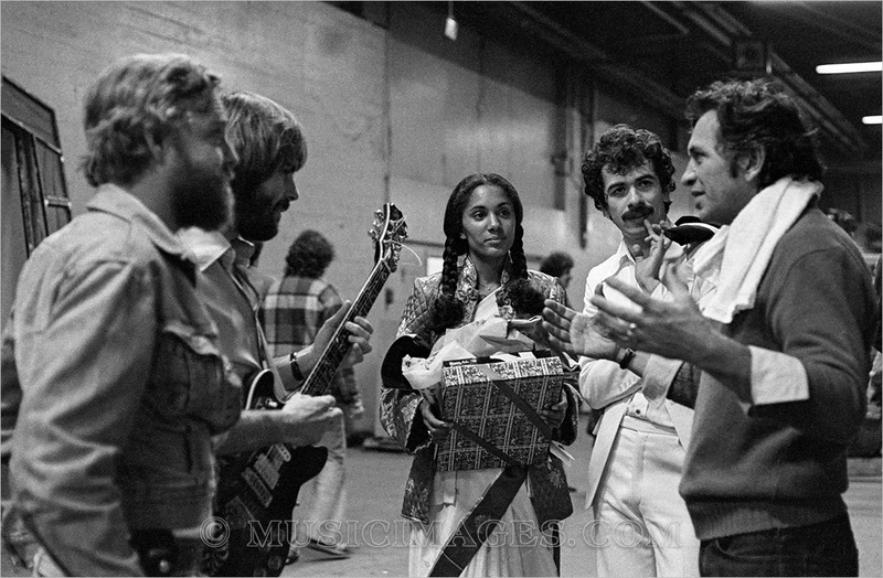 B119-10.jpg :: John Barlow, Bob Weir, Carlos Santana & wife, Bill Graham - NYE 1976 at the Cow Palace, San Francisco