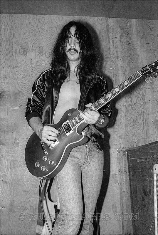 B673-3.jpg :: Craig Chaquico warming up - Frost Amphitheater, Stanford Univ., Palo Alto, Ca. 8/31/80