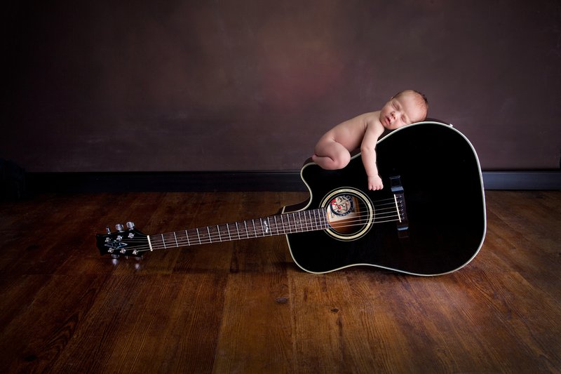 Newborn Photographer Kansas City Newborn Portrait 16.jpg :: This image was created combining multiple images into one through the magic of photoshop!  The parents were holding on both sides, and the baby was on a blanket!  
