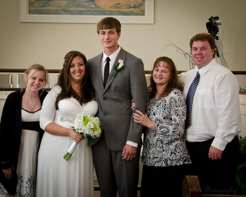 Bride and Groom with family.jpg