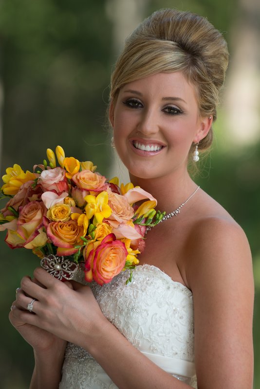 Bride with bouquet outdoors.jpg