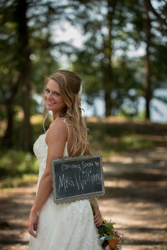 Bride with sign.jpg