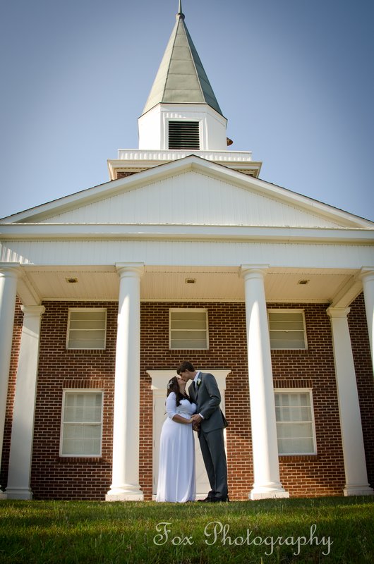 Couple kissing outside church 1.jpg