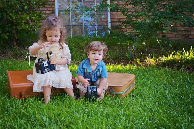 Children outside with old camera.jpg