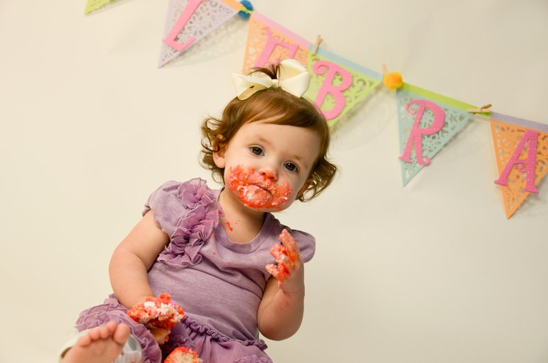 First Birthday Girl with banner.jpg