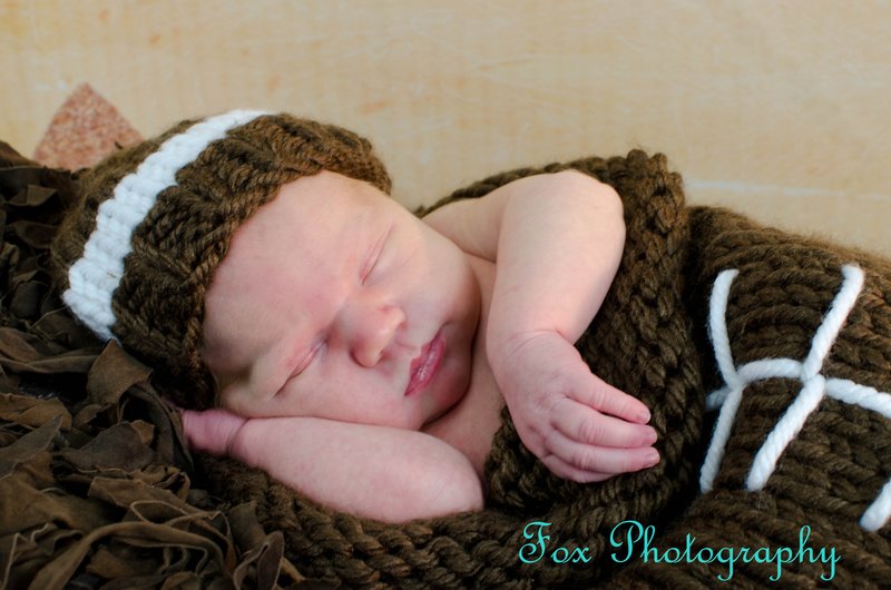 Newborn Football baby.jpg