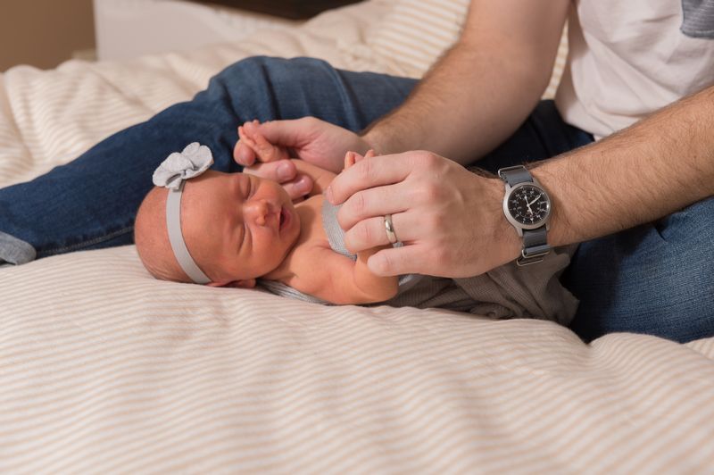 Newborn with Dad.jpg