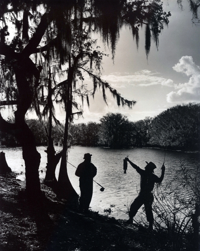 CCE 3-121 in silhouette holding bass at Fisheating Creek SFOP 11x14.jpg